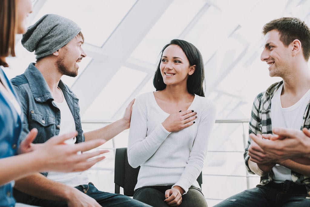 group of three people sitting around finding rehab centers in Orlando FL