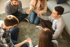 group of people sitting around at depression treatment program