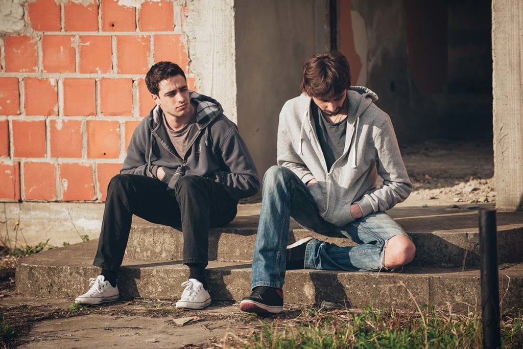two young men struggling with overcoming codependency