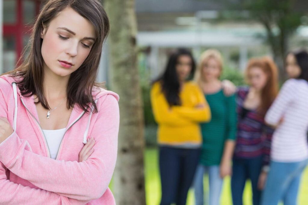 Young person experiencing peer pressure and substance abuse simultaneously