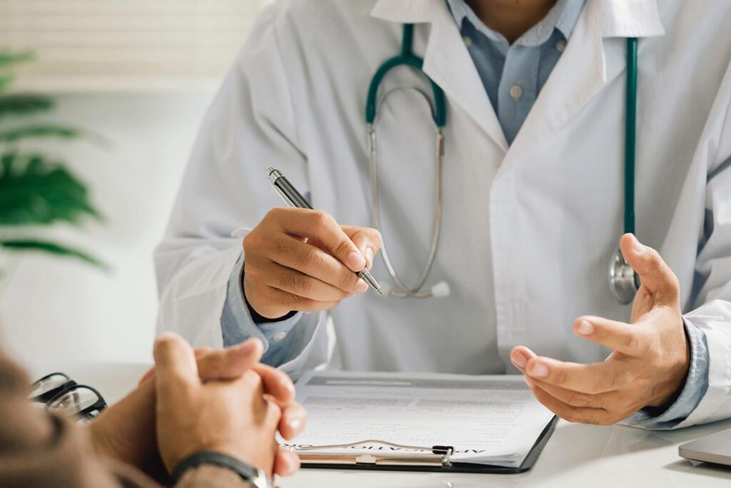 Hands of a doctor explaining wet brain symptoms