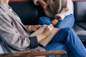 Hands of people in a drug rehab program