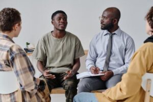 People sitting in a circle at a partial hospitalization program