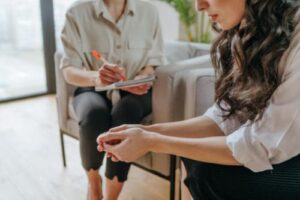 Hands of people in a meth rehab program