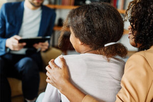 Back of child in a family therapy program