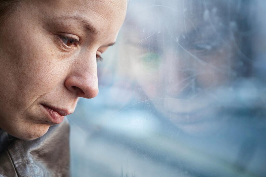 Person thinking about the dangers of using opioids during winter