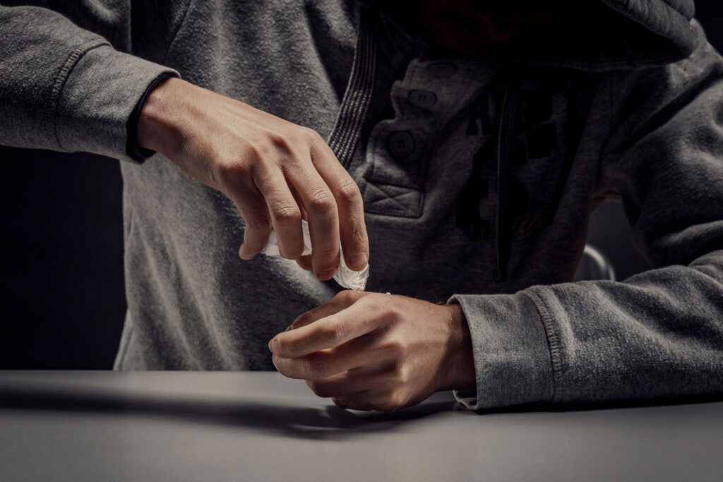 Hands of a person learning what fish scale is