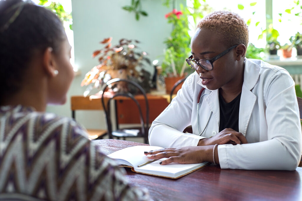 Person talking to their doctor about how alcoholism and bariatric surgery are linked