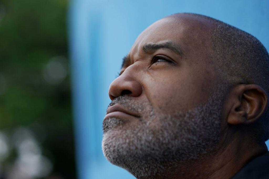 A man gazes up at the sky. He is experiencing Xanax side effects.